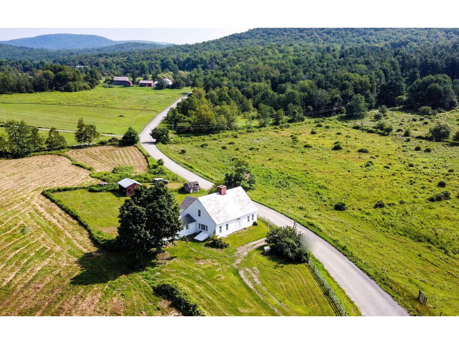 11 acres with VT Land Trust protected land (80 acres) across the road