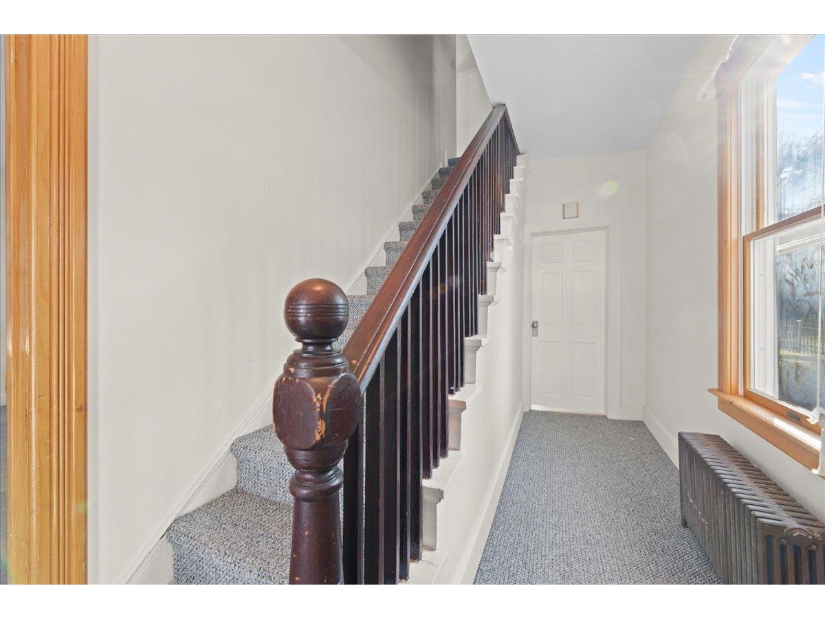 Front entry, staircase to 2nd floor (2 bedrooms/1 bath)