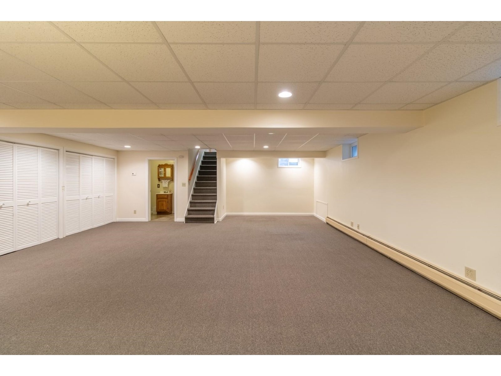 Large open fnished basement with storage and 3/4 bath