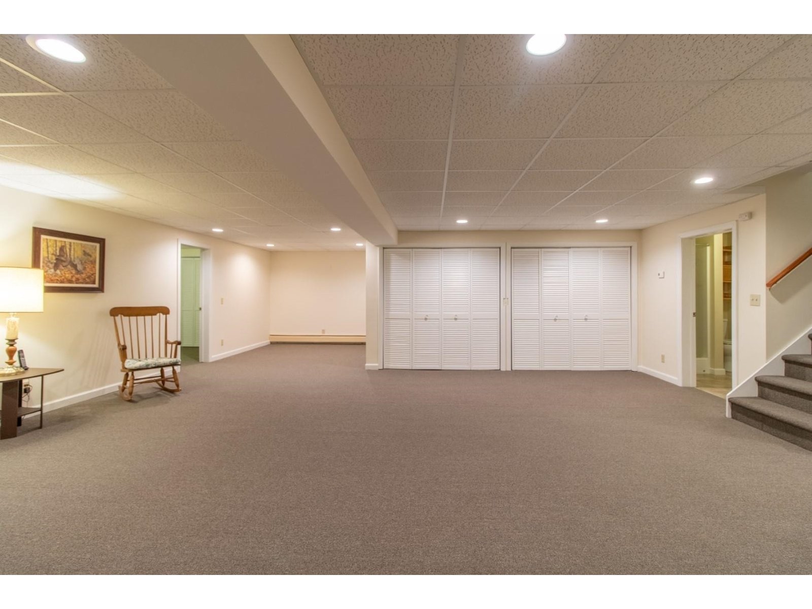 Large open fnished basement with storage and 3/4 bath