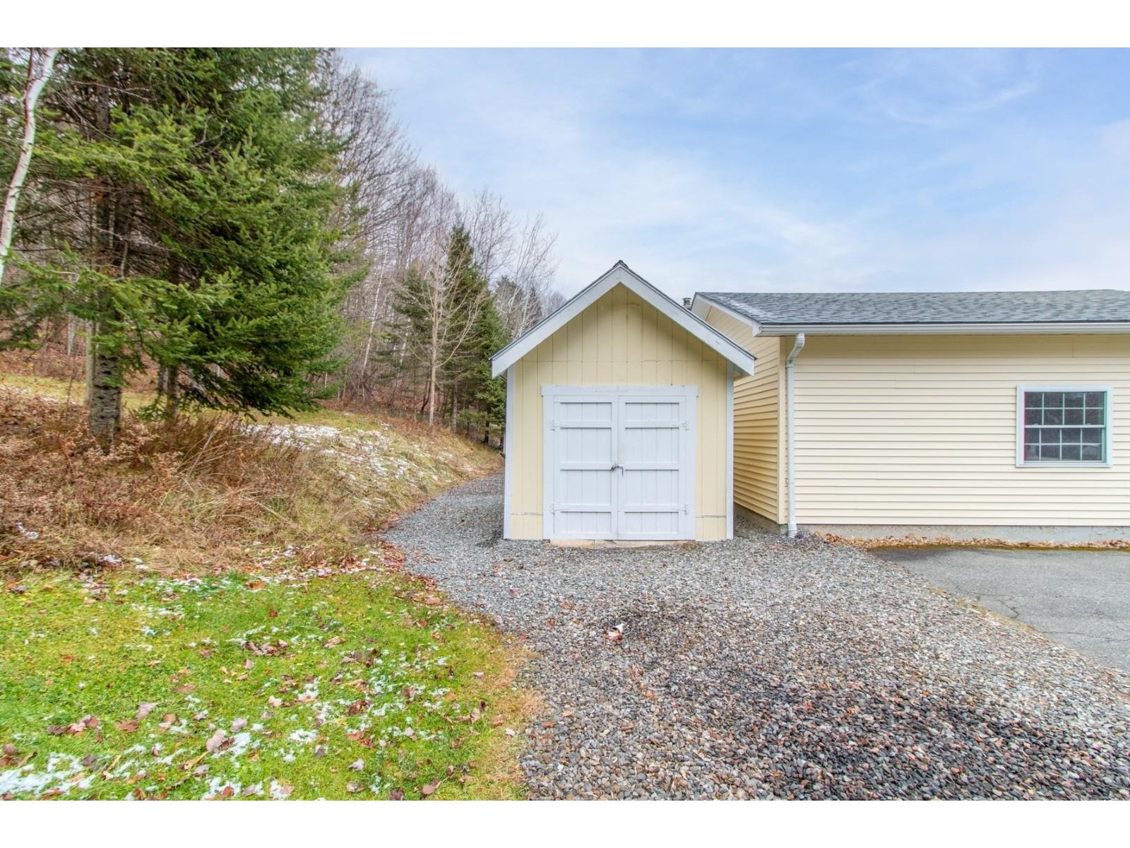 Storage shed behind the garage