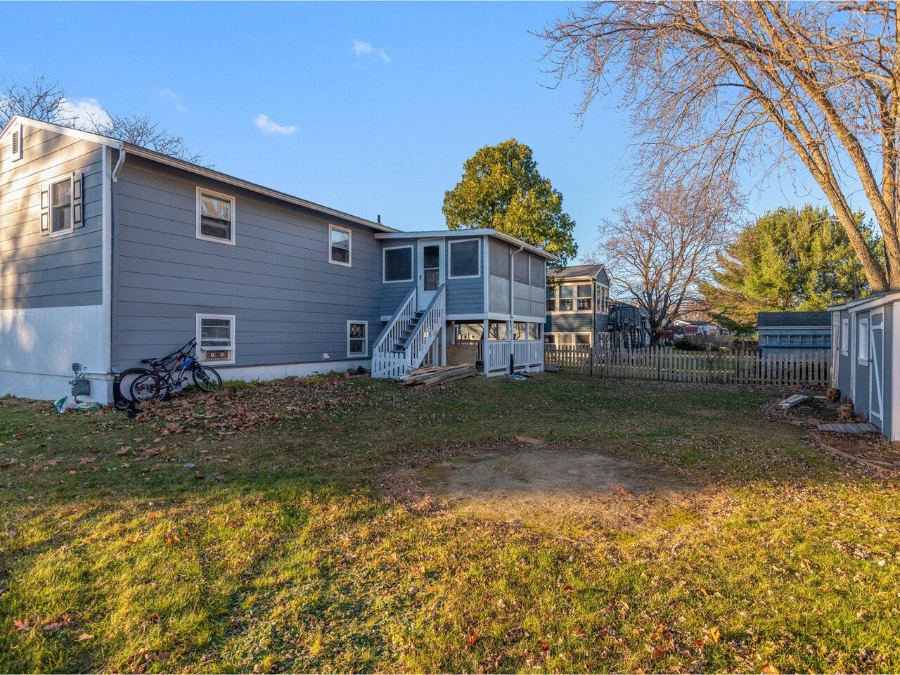 Porch overlooks backyard