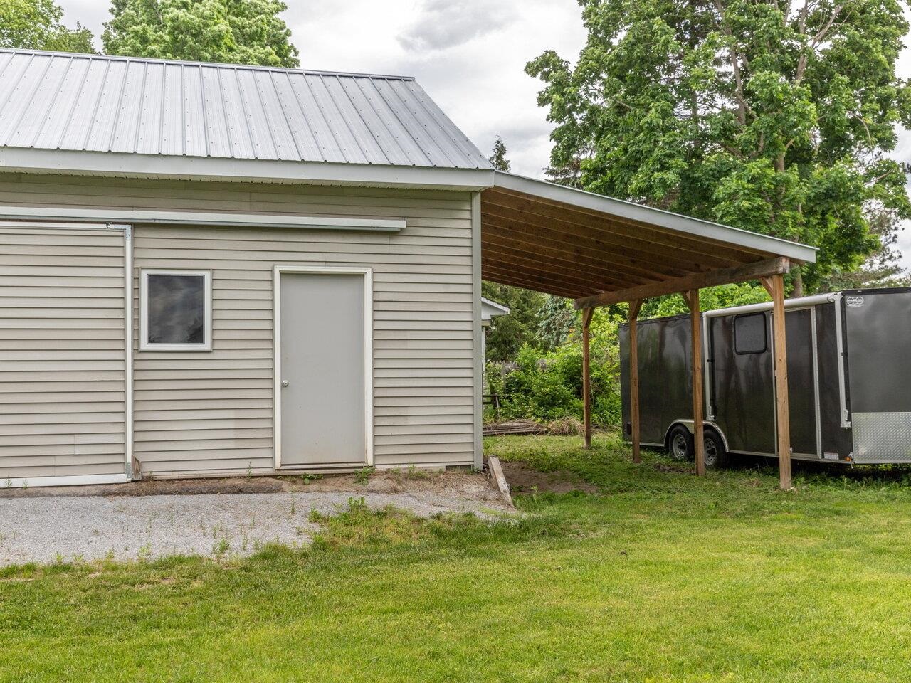 Boat Leant-to Behind Garage