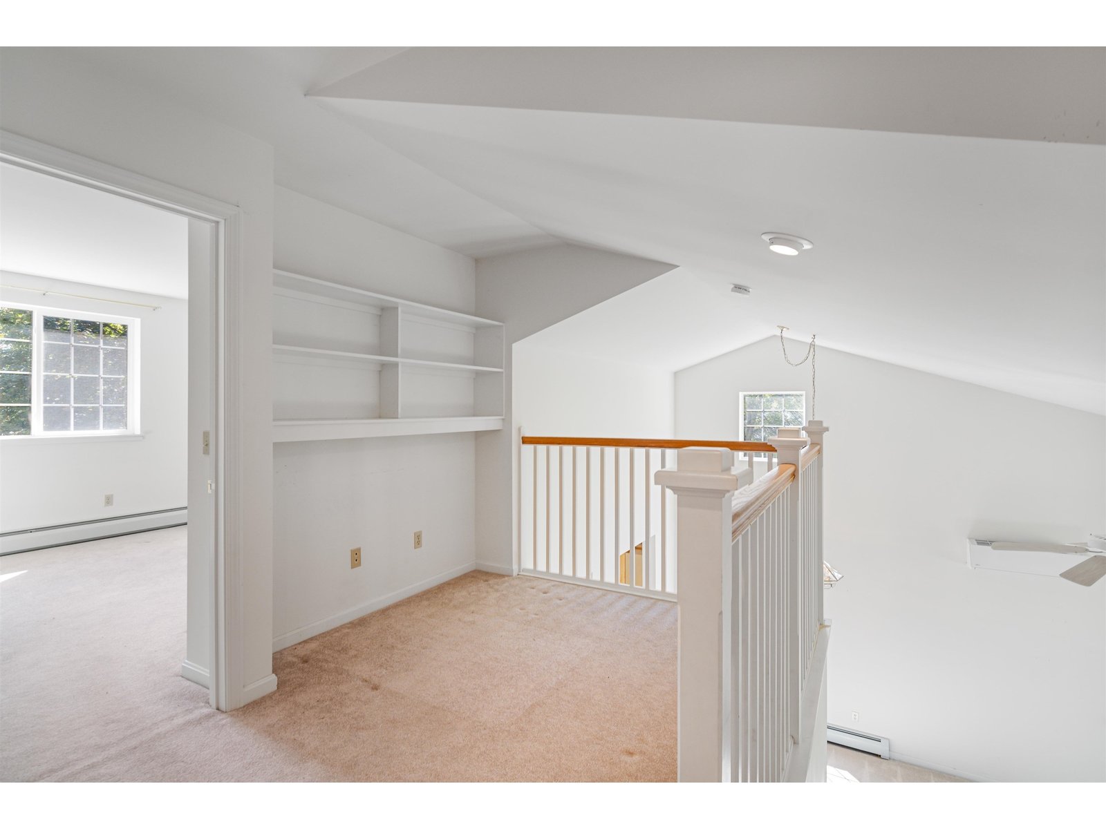 Second floor landing with bookshelves