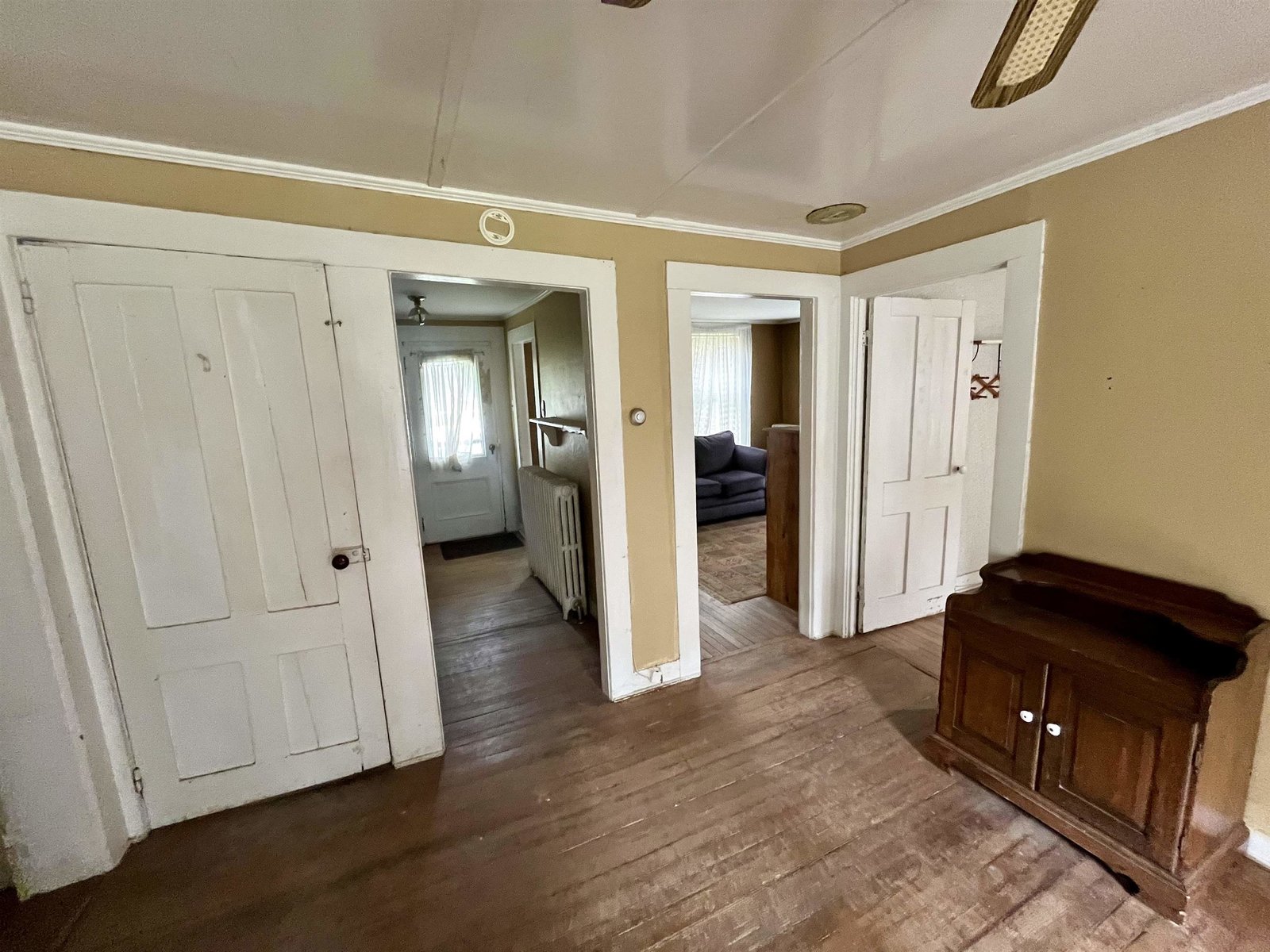 Hallway from dining room to front entryway and living room