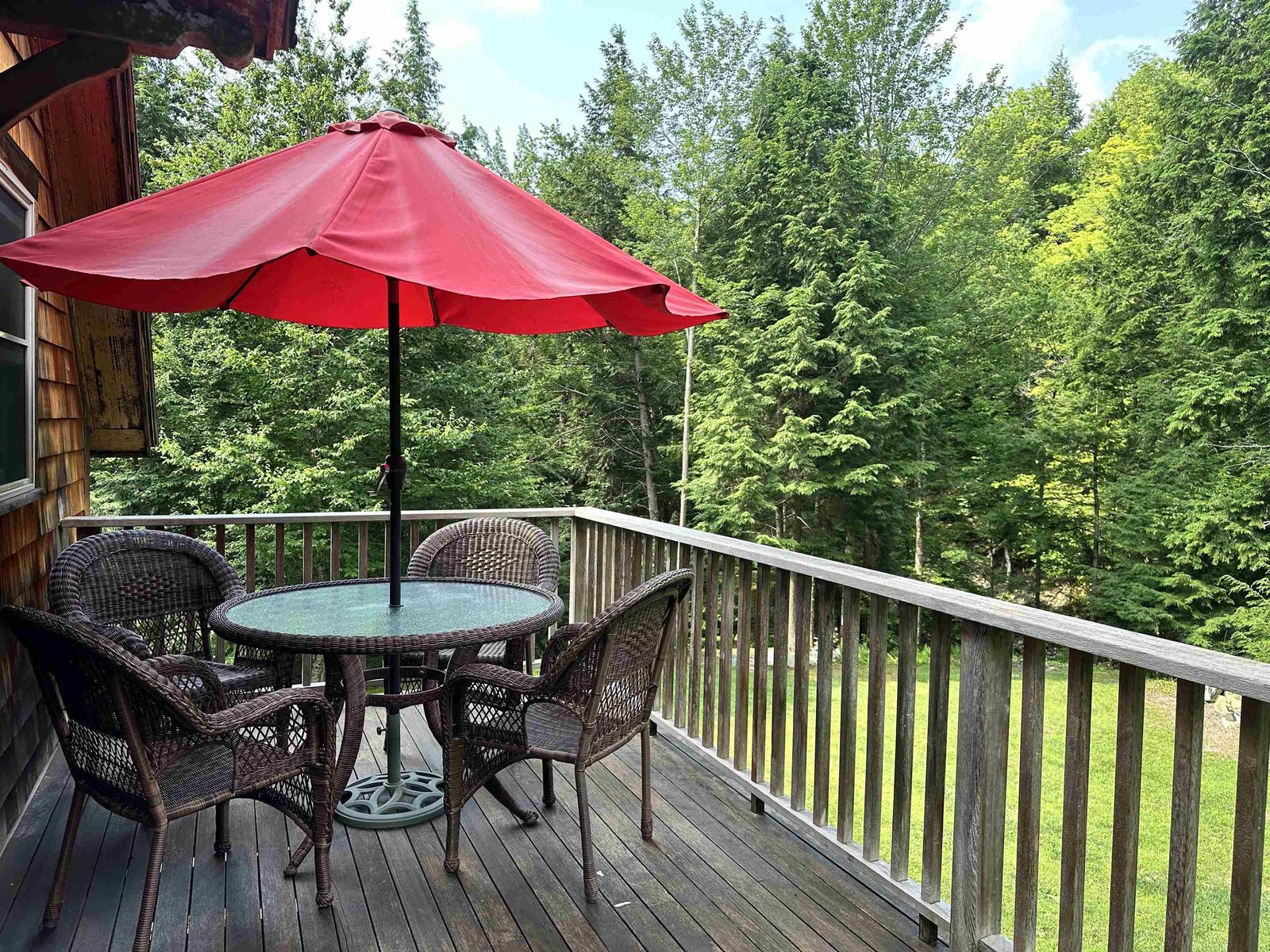 Second level deck has a staircase to back yard