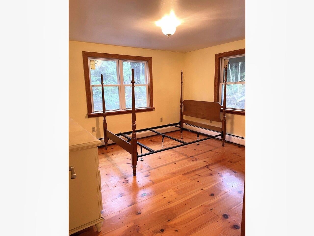 Primary bedroom w/pine floors