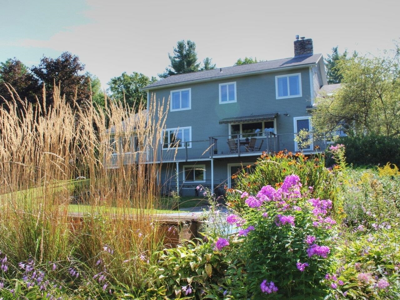 Gardens beside in-ground pool