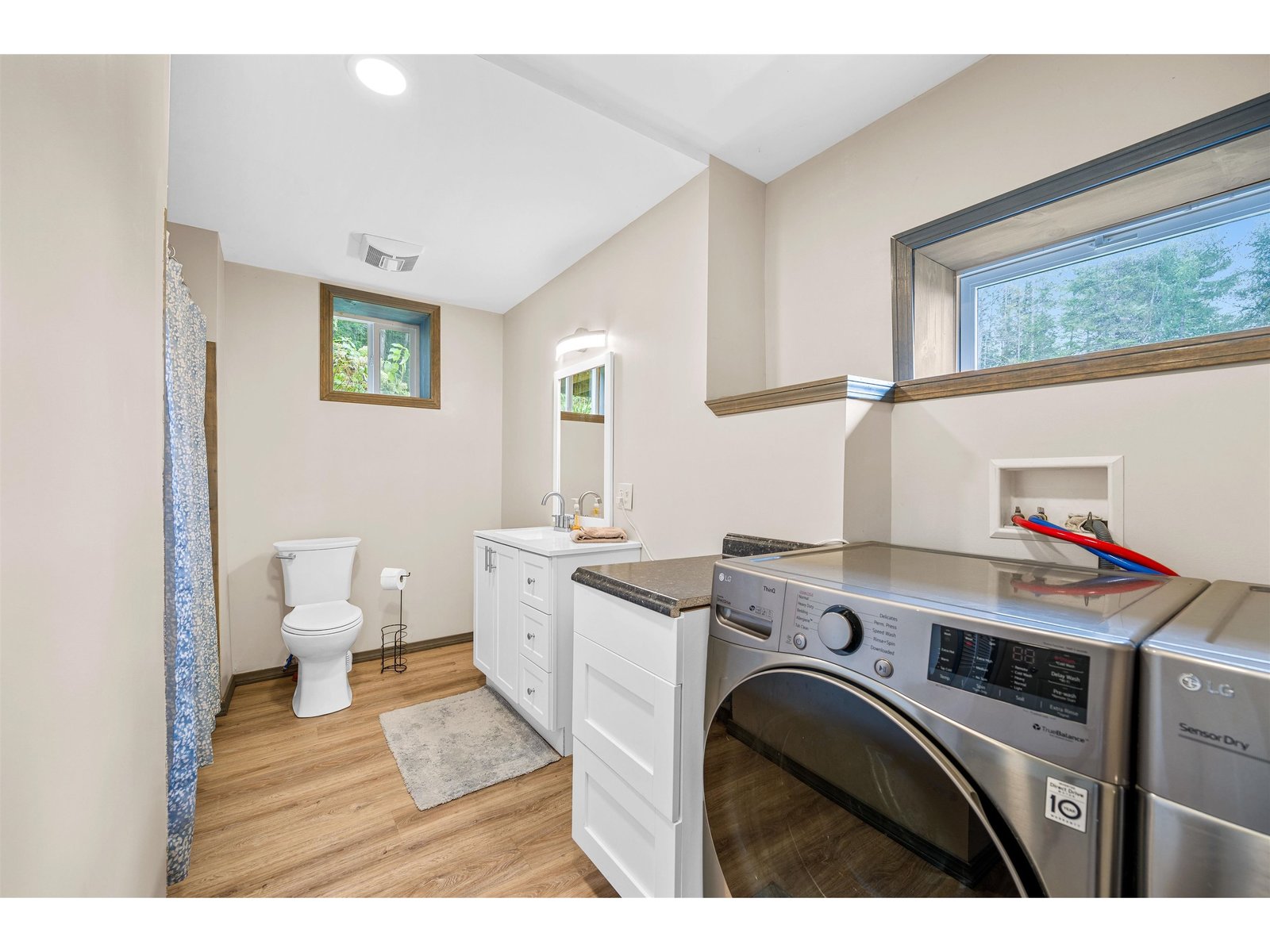 Laundry and full bathroom in basement