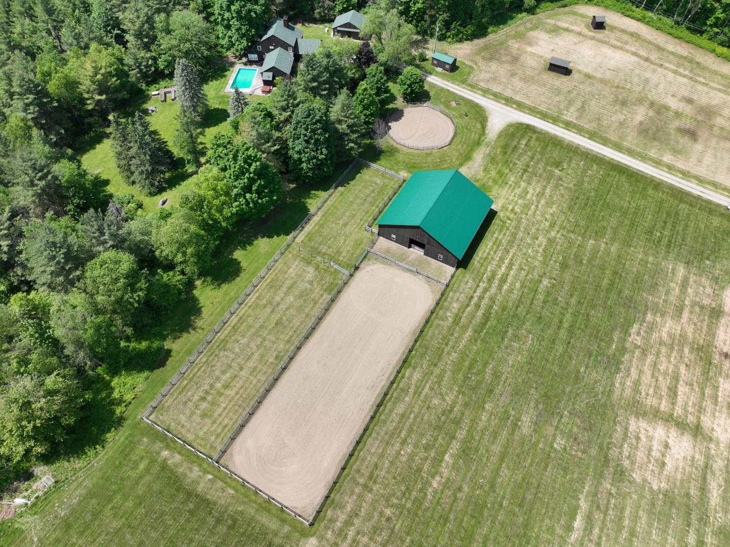 60x60 indoor riding arena with outdoor riding areas also