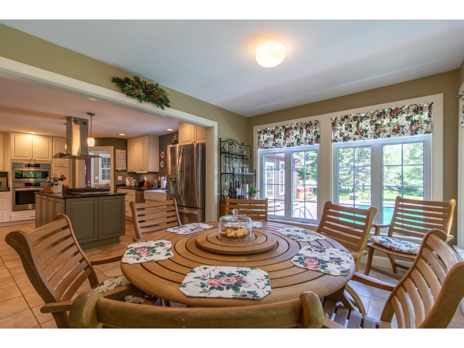 Dining area off Kitchen and pool out the window