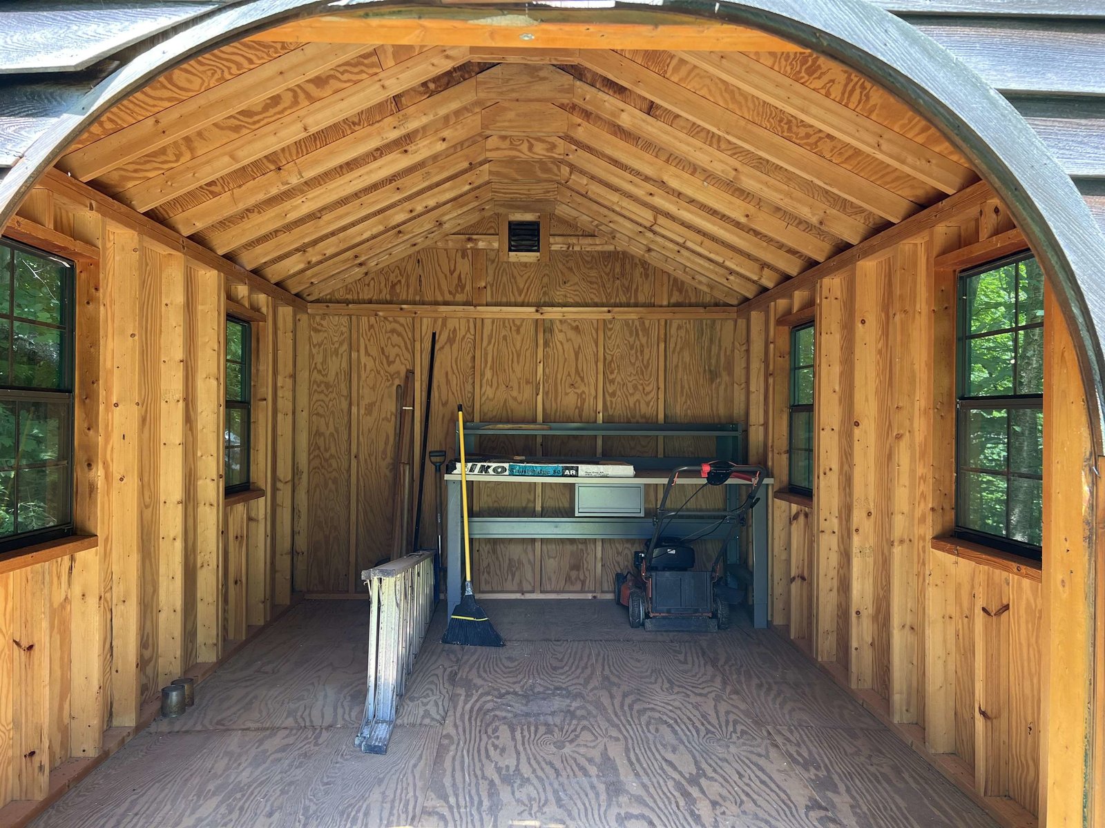 Shed windows have screens to let the summer breezes in