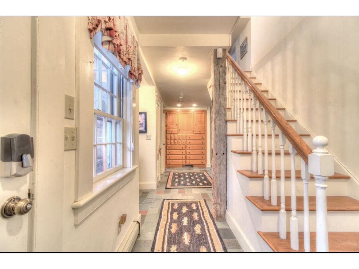 Mudroom Entry with a slate floor and plenty of storage