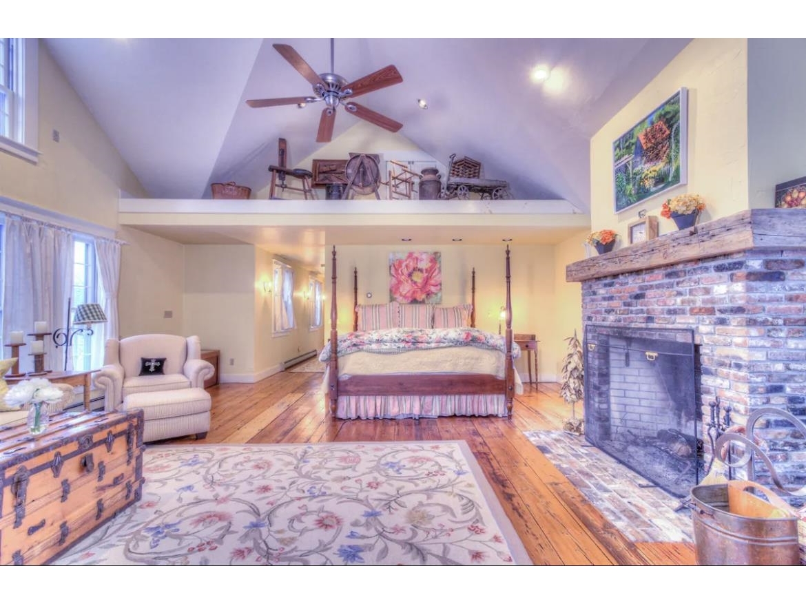 Master suite with a wood burning fireplace