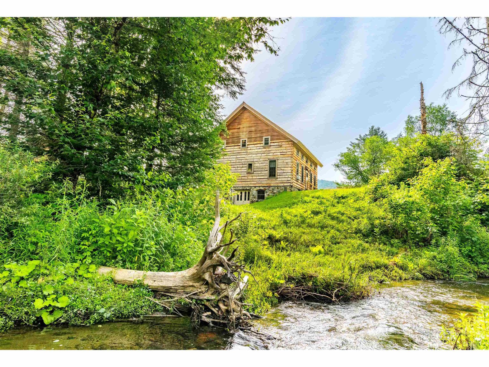 Brook alongside the home