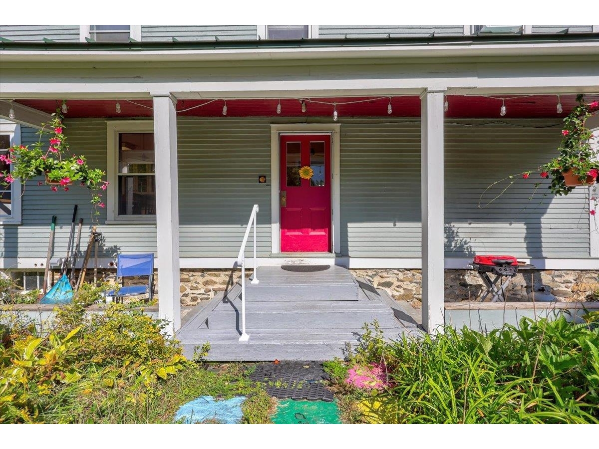 Covered porch off of parking area