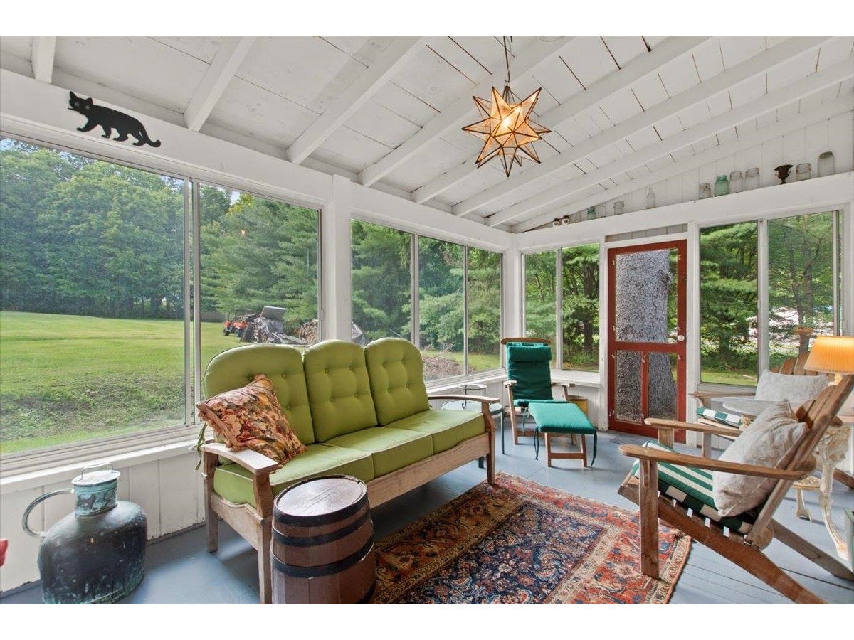 Screened porch with views of park-like setting in the backyard.