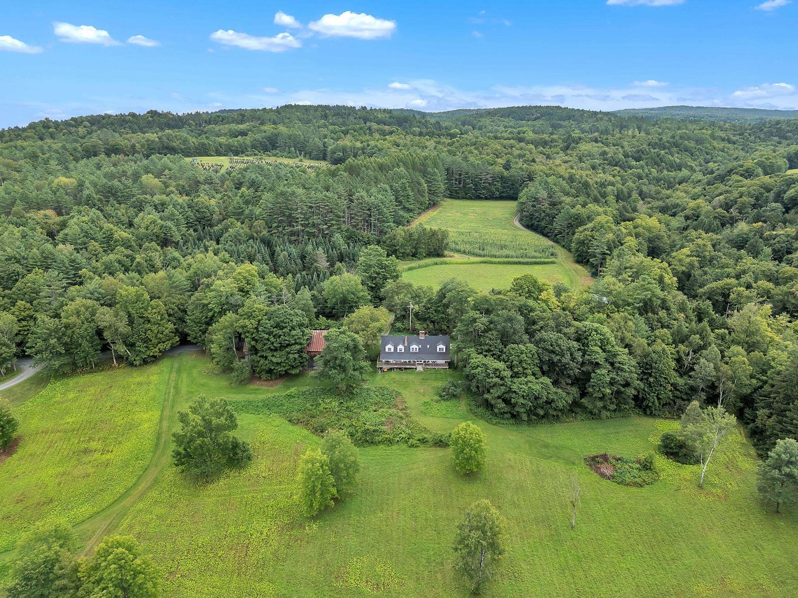 Aerial view of the home and surrounding land