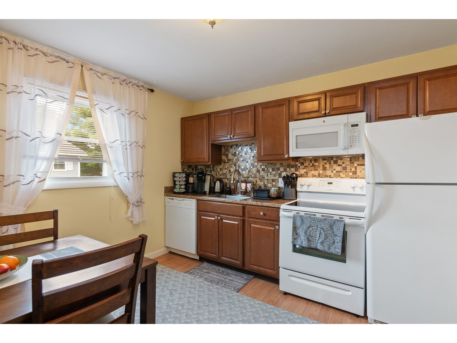Eat-in kitchen with direct access to the back stairwell.