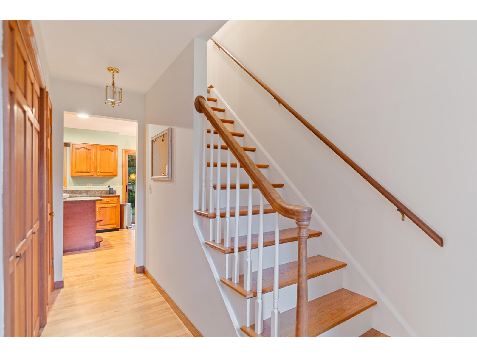 Foyer with hardwood staircase