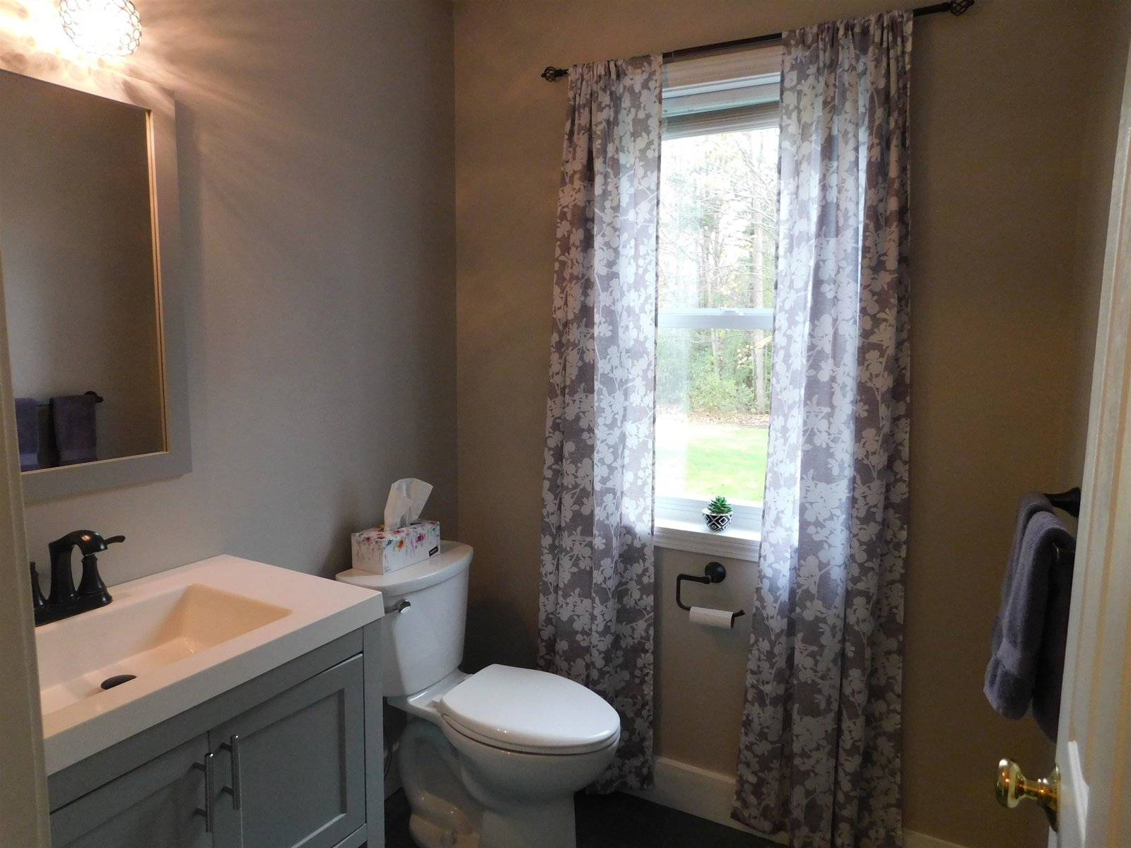 Green slate flooring in the 1/2 bath and mudroom.