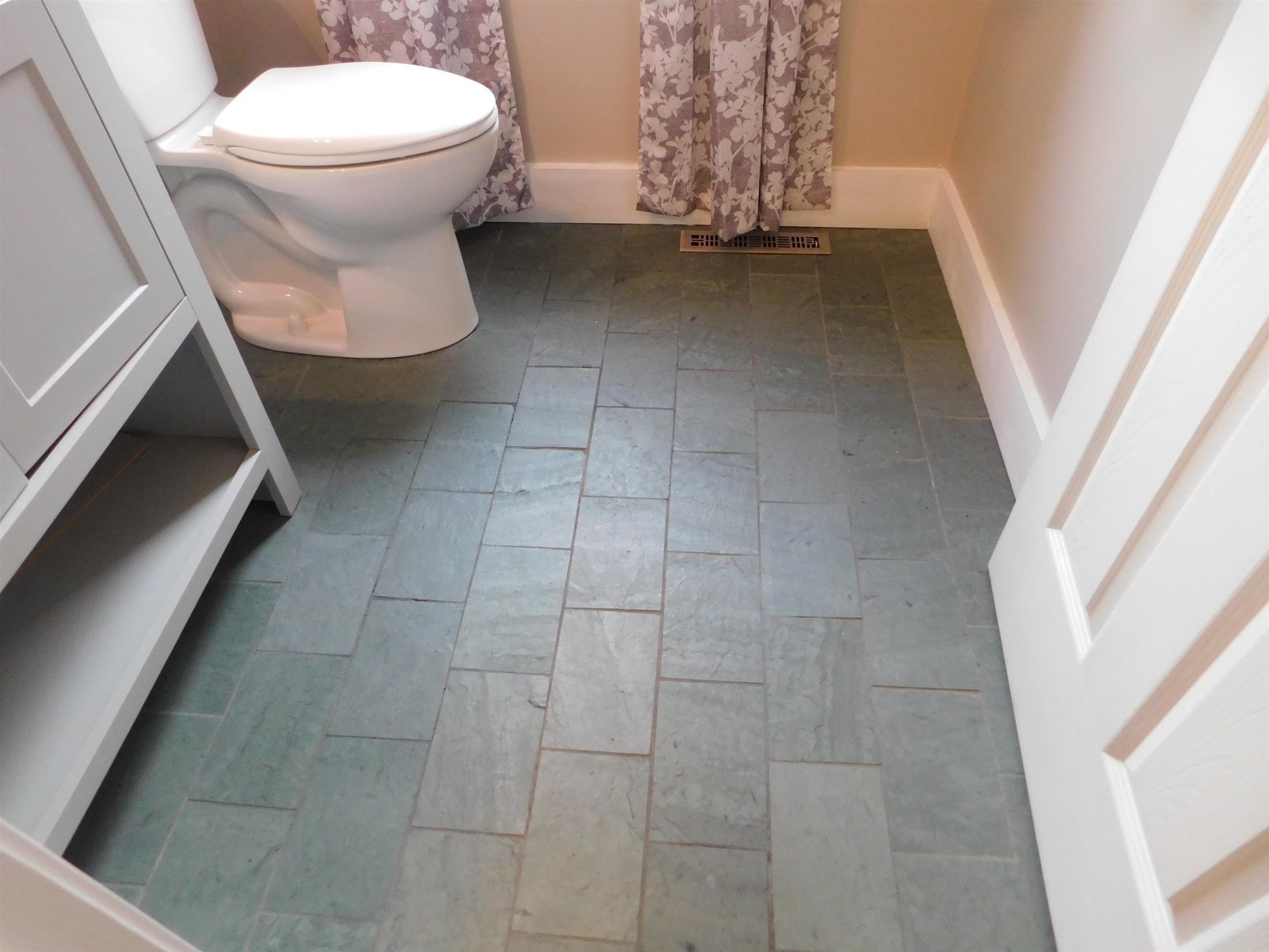 Pantry to the right and basement staircase to the left.