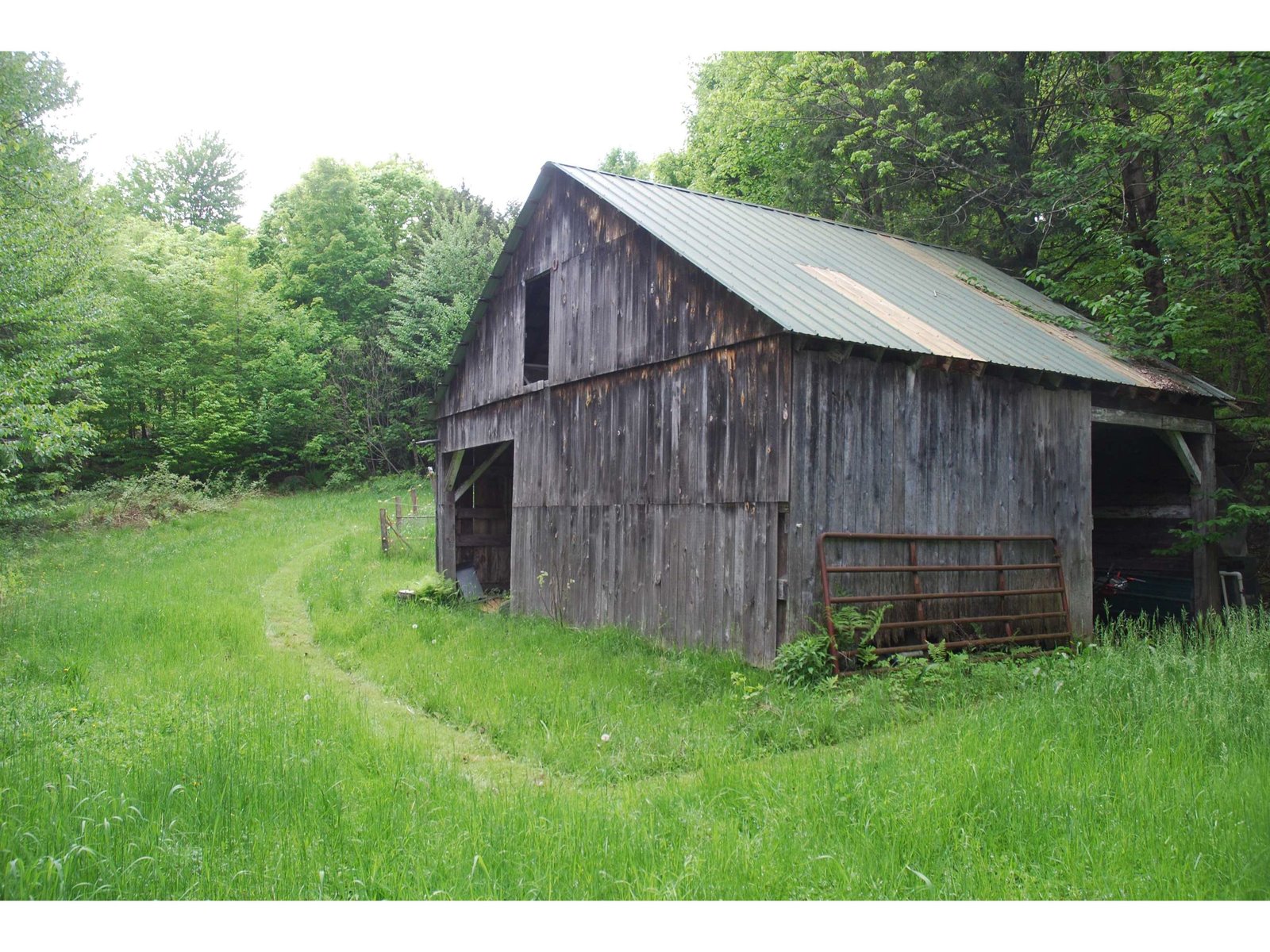 Horse barn w/ path to house.