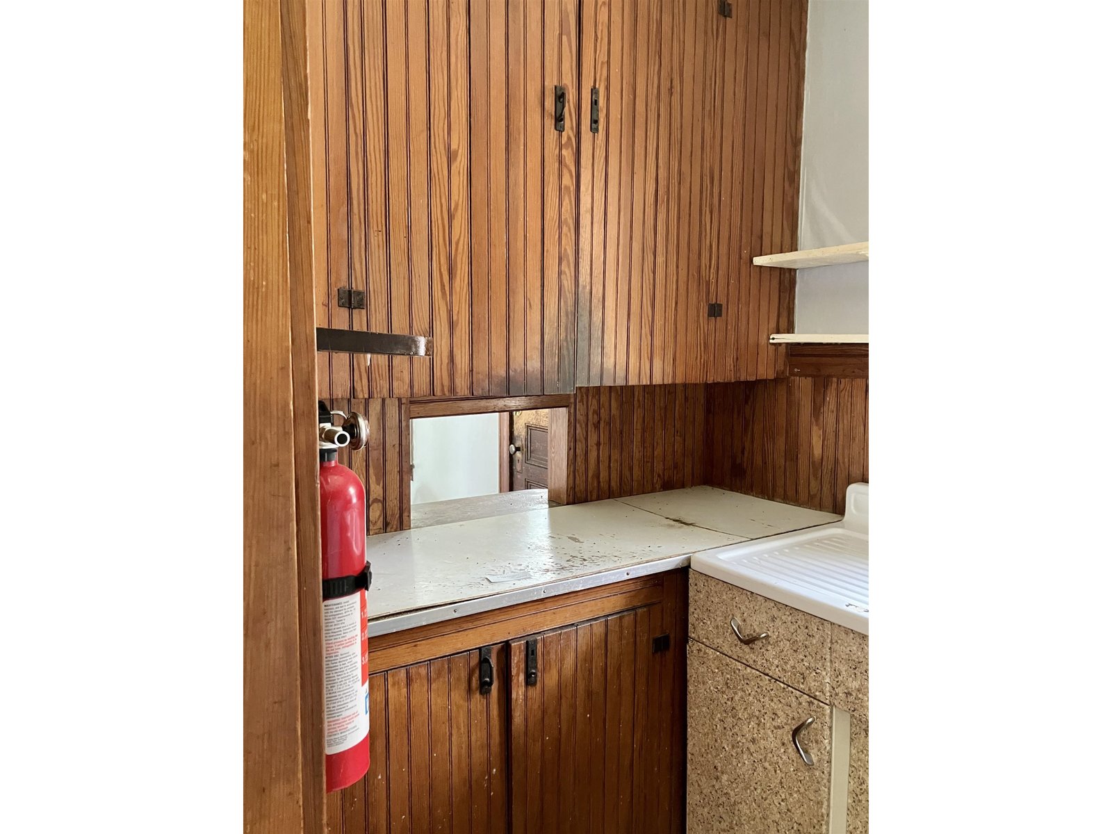 Unit A - Butler's pantry with wood cabinets