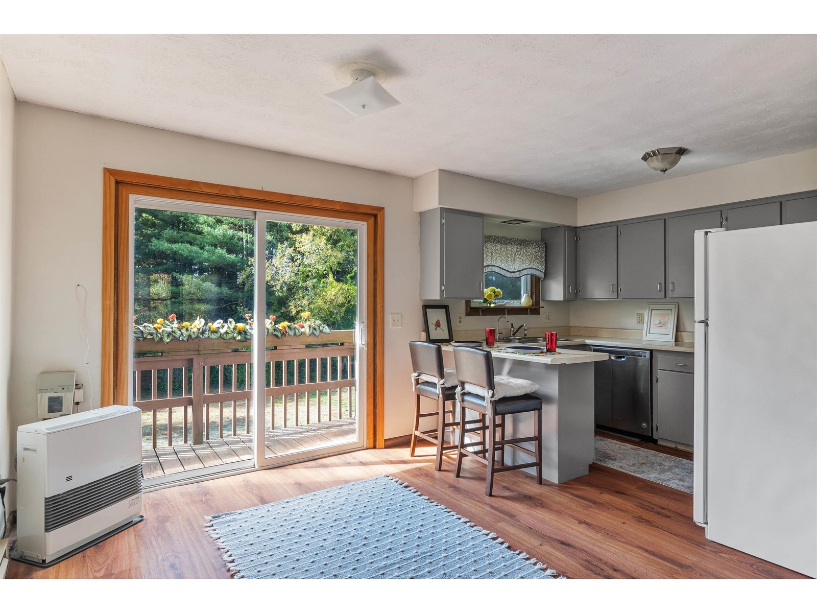 dining area, slider to balcony and kitchen