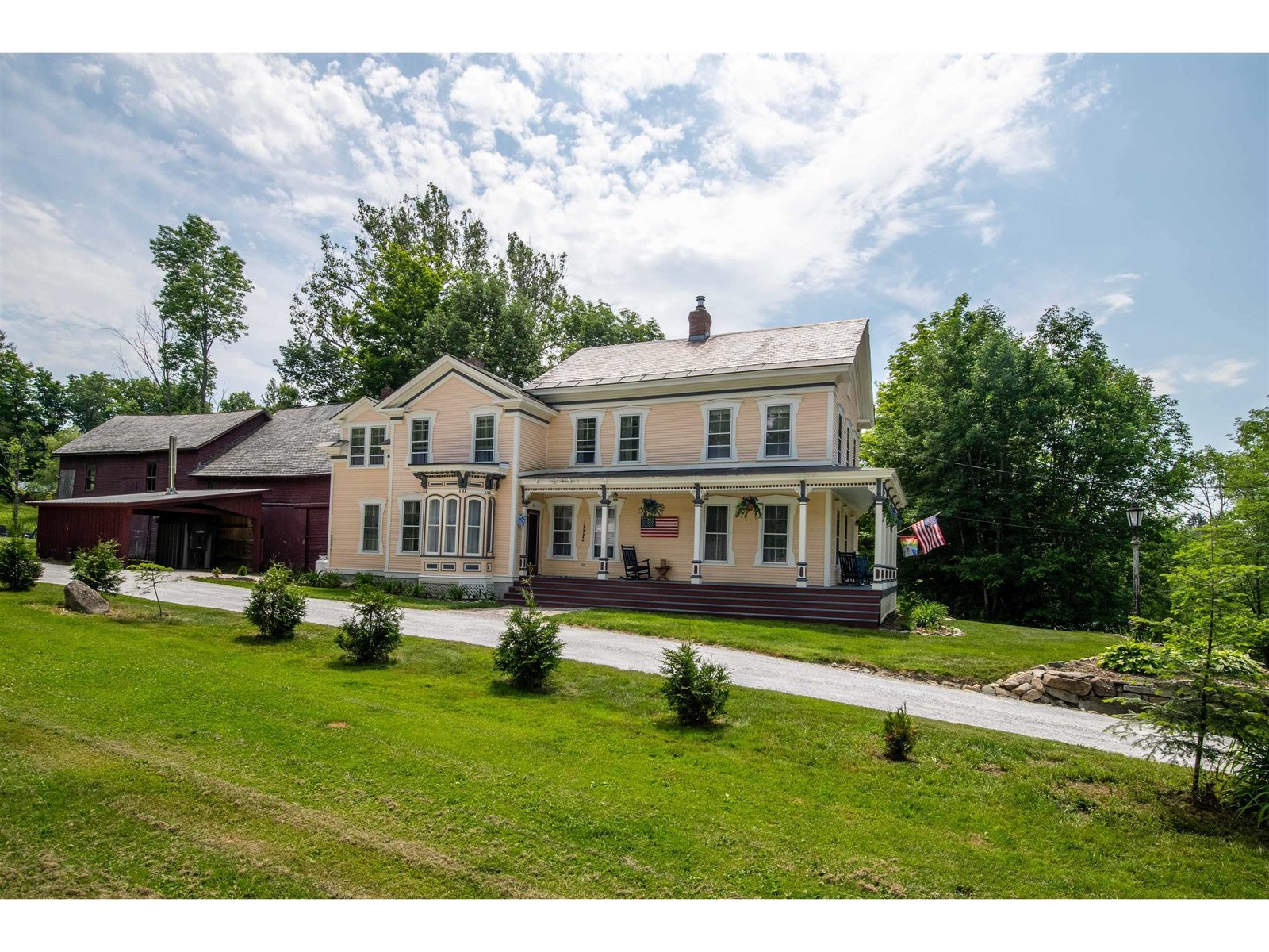 Victorian style home with attached barn