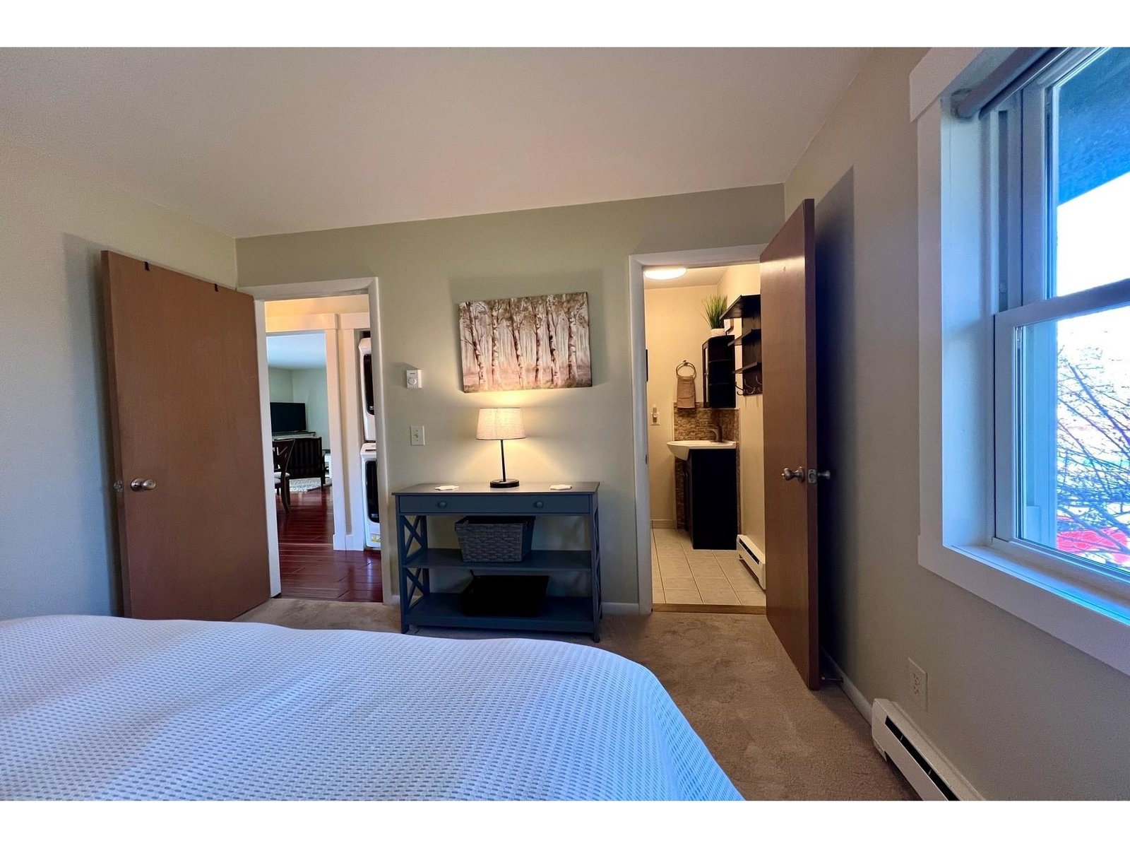 Primary bedroom with view into living space