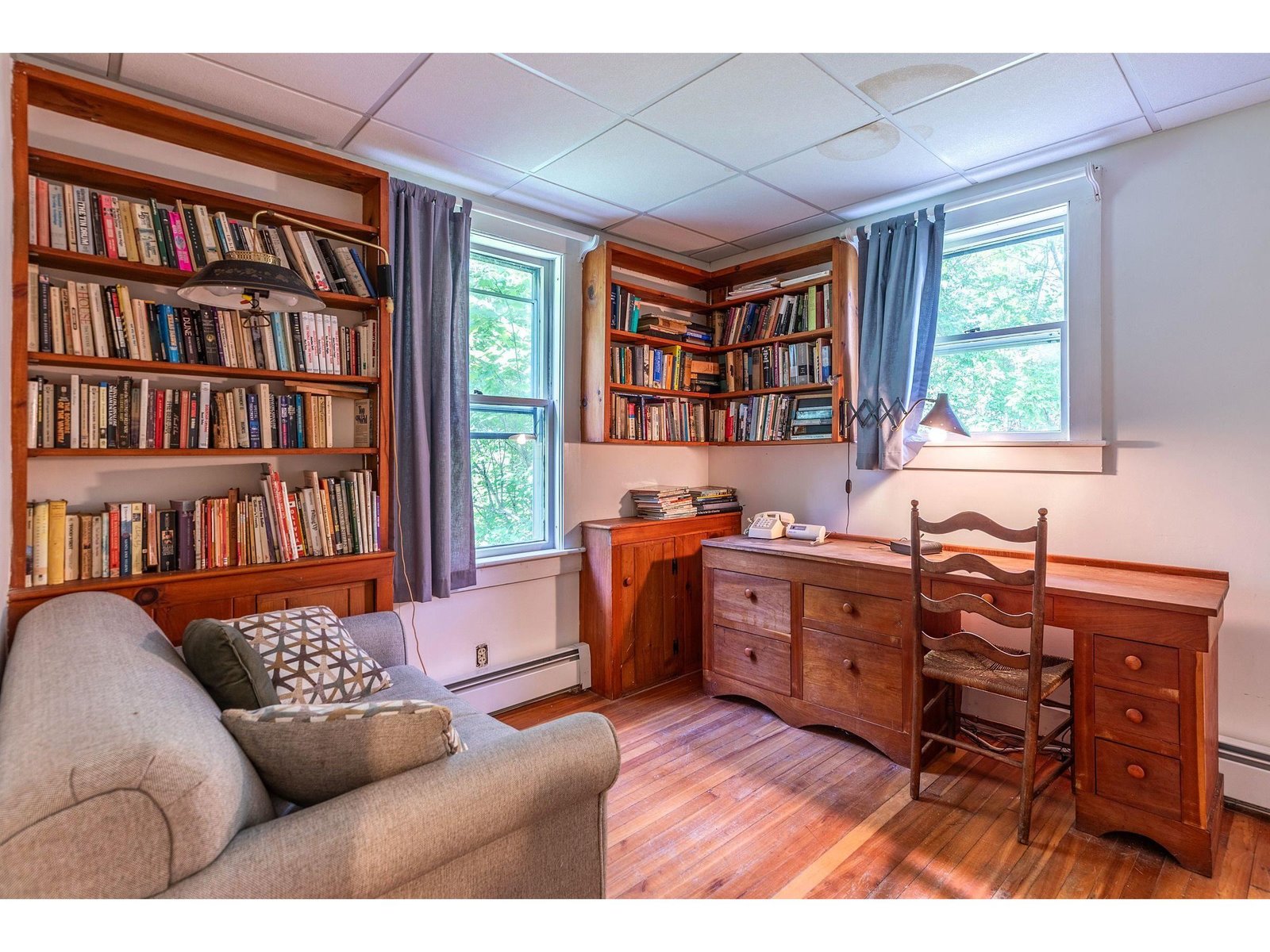 Large office and den area with bookcases galore