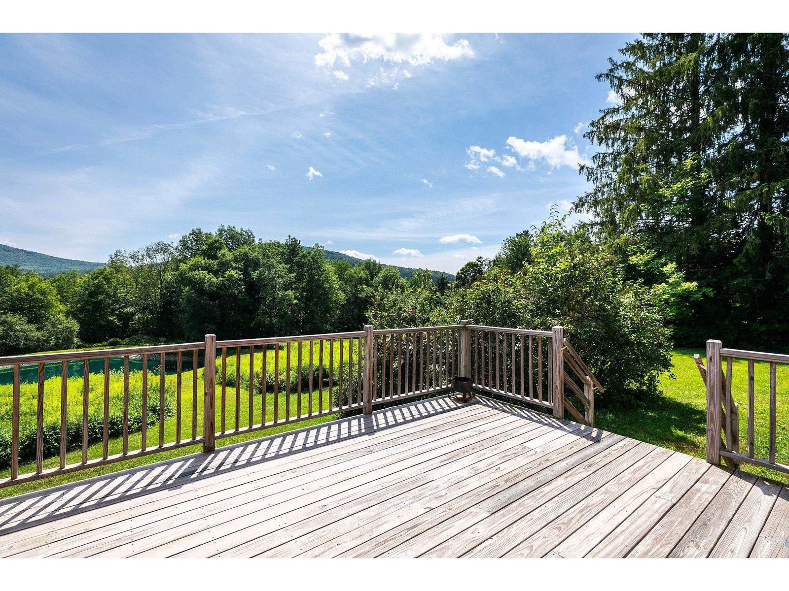 Nice deck in back of the house with views ; and great place to enjoy Vermont