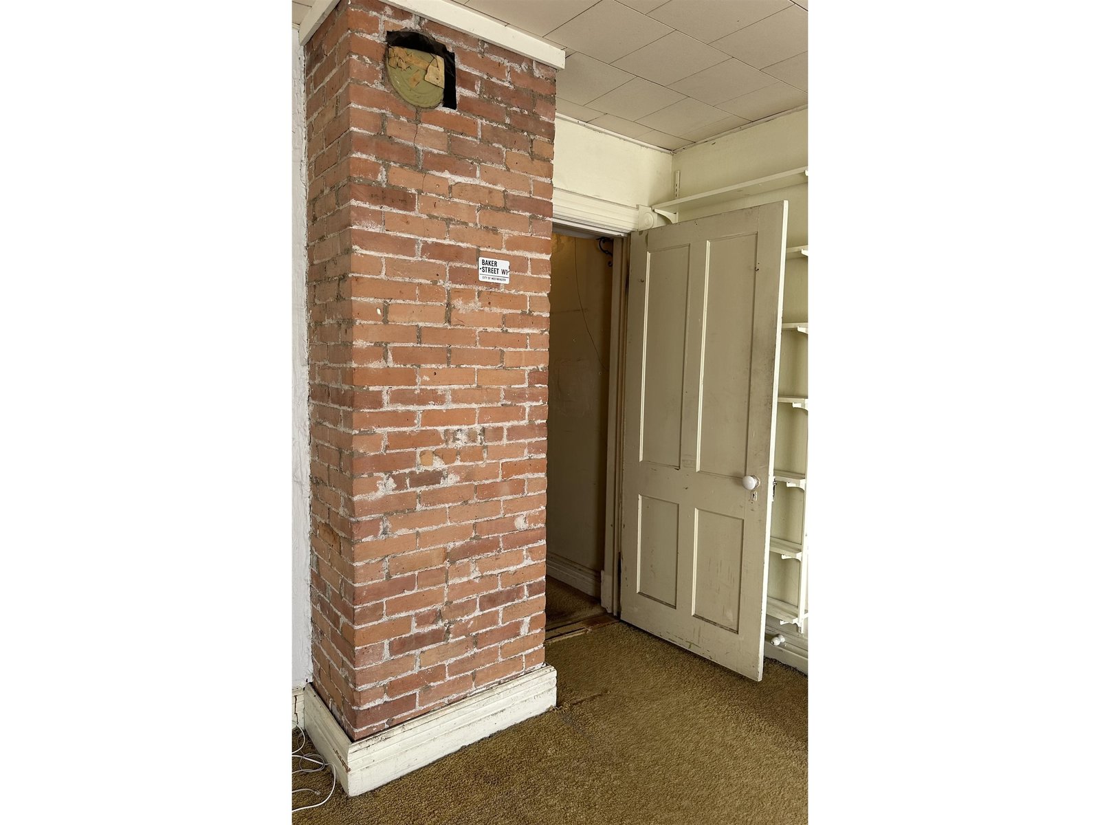 Second floor bedroom with exposed brick