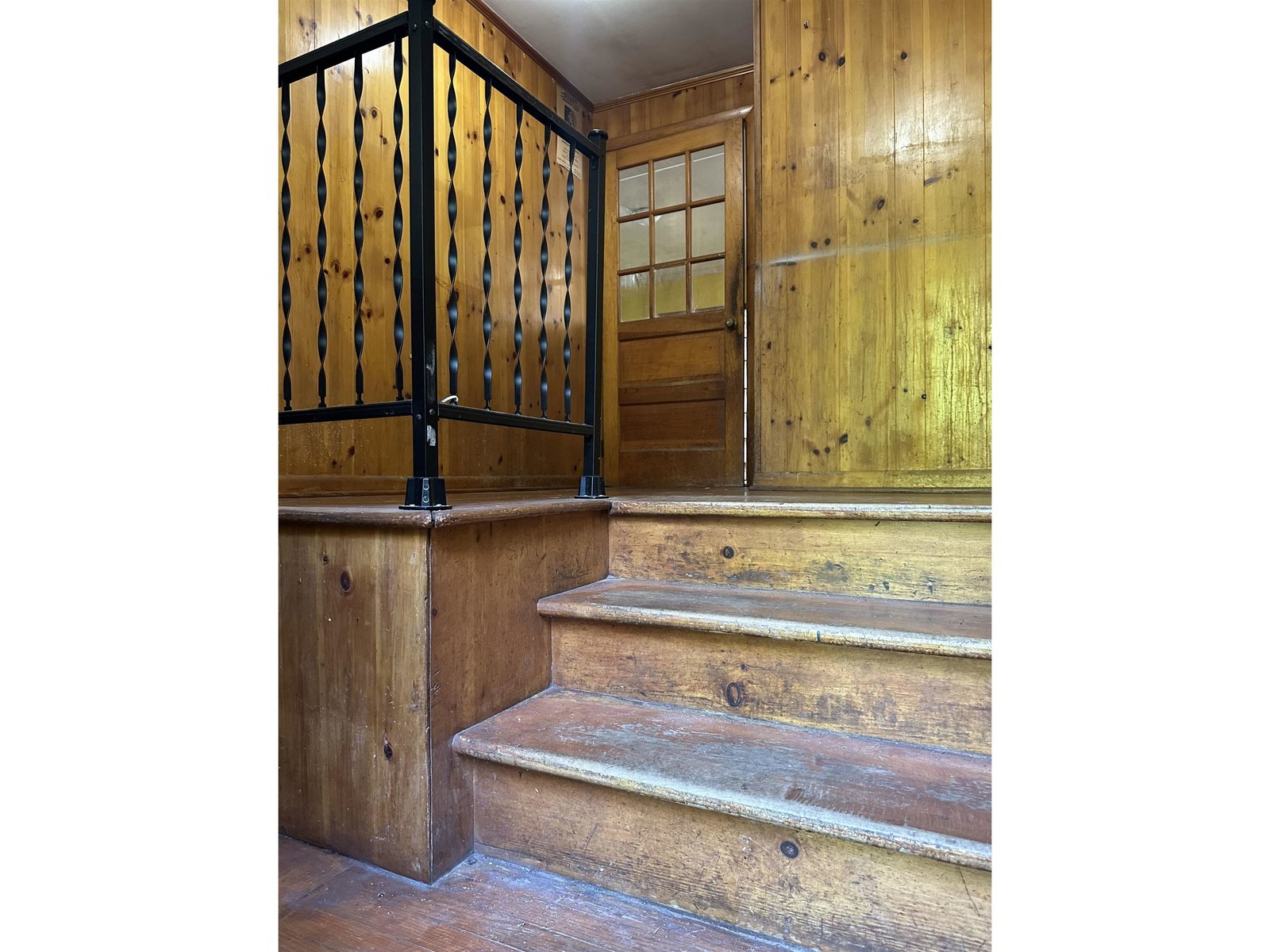 Generously sized back entrance suited for a mudroom and access to basement