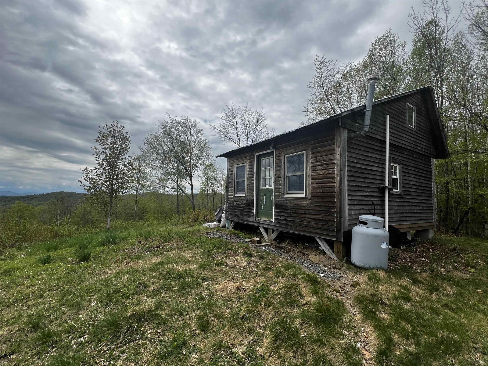 unfinished cabin atop the land