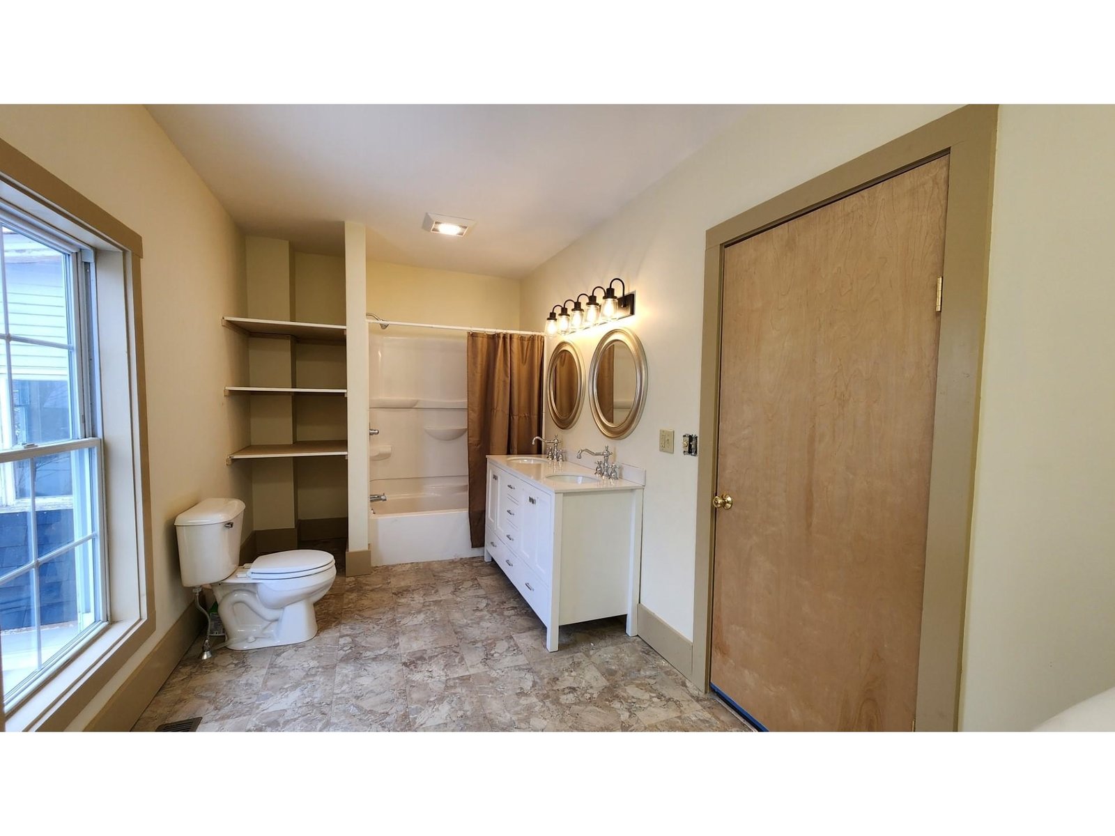 Large upstairs bathroom with laundry