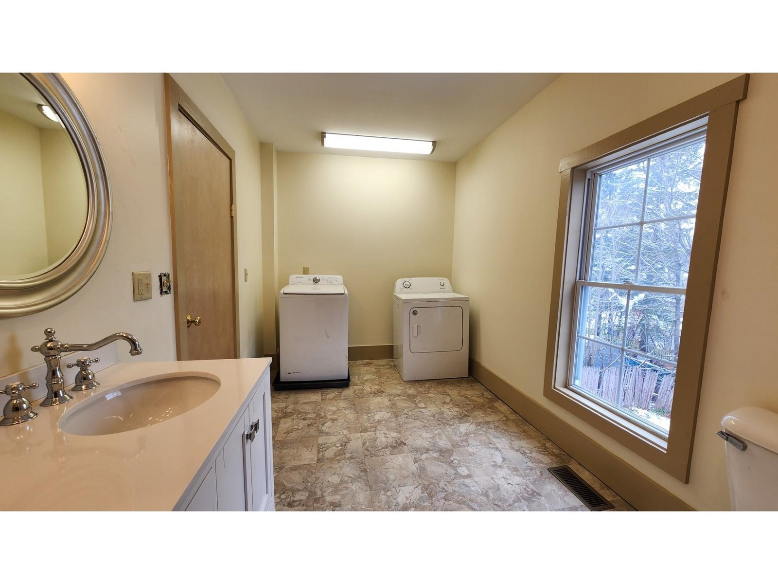 Large upstairs bathroom with laundry