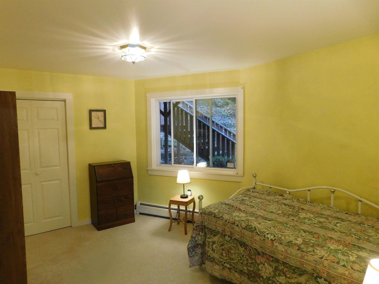 Bright and pleasant lower level bedroom.