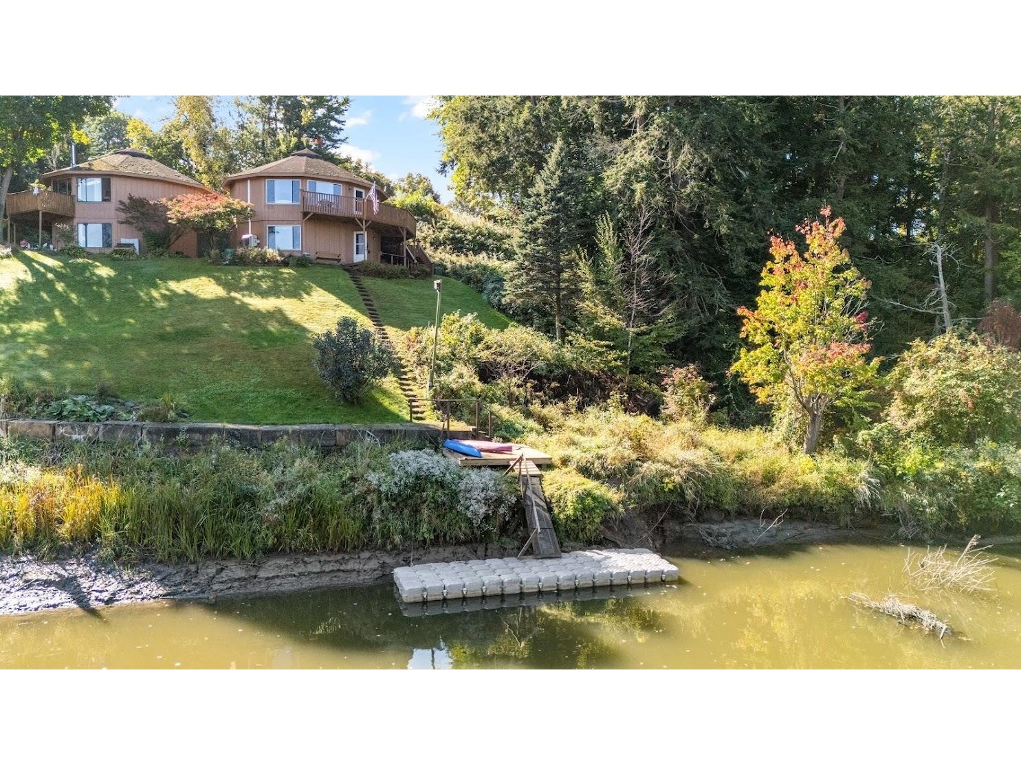 Alternative perspective shows the concrete bulkhead and portions of the property.